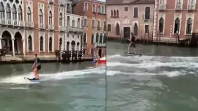 Turistas sao multados por surfar nos canais de Veneza